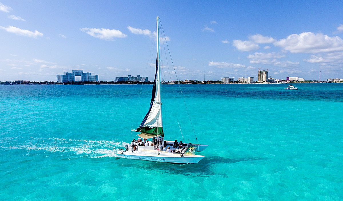 private catamaran near cancun with fun people around