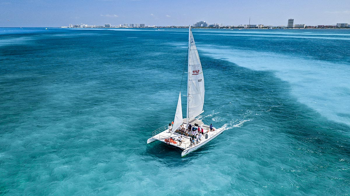 Catamaran Next Wave Cancun with drone near Isla Mujeres